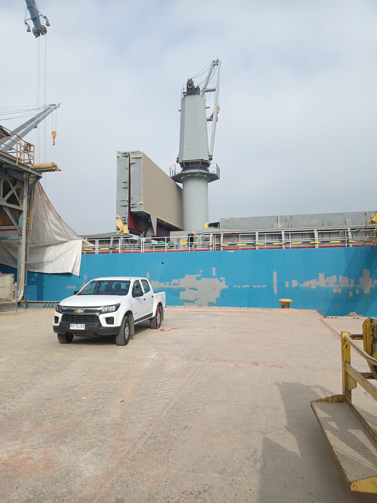 Atenas delivery truck alongside vessel